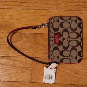 Coach wristlet with tags